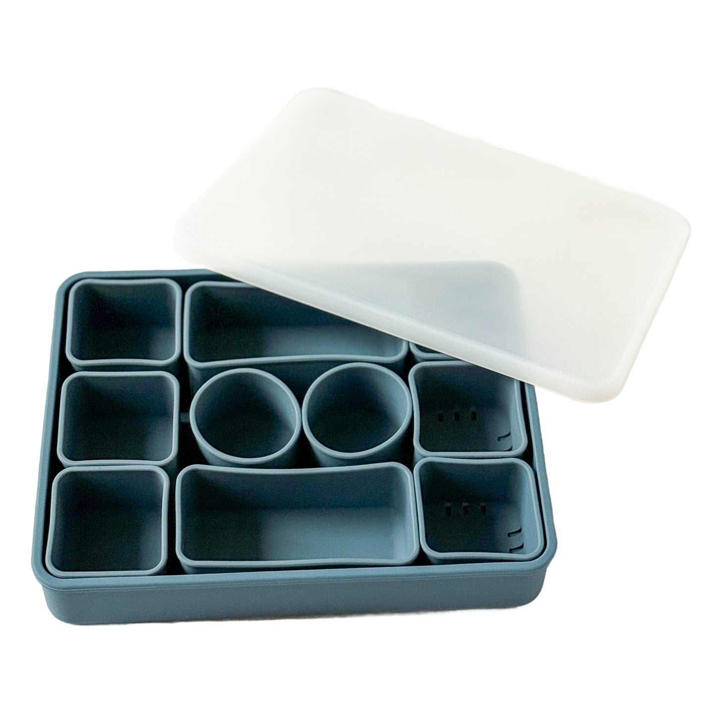 Blue silicone Snackle box with lid with 10 removable compartments.