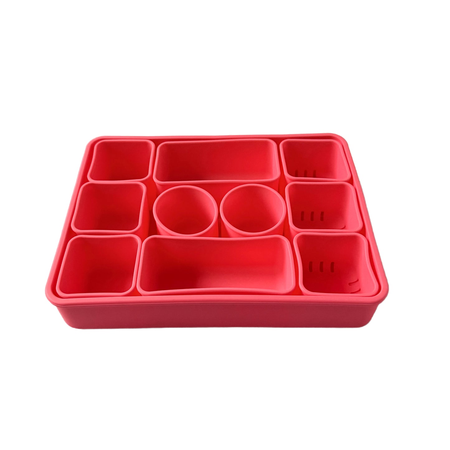 Pink silicone Snackle box with 10 removable compartments.