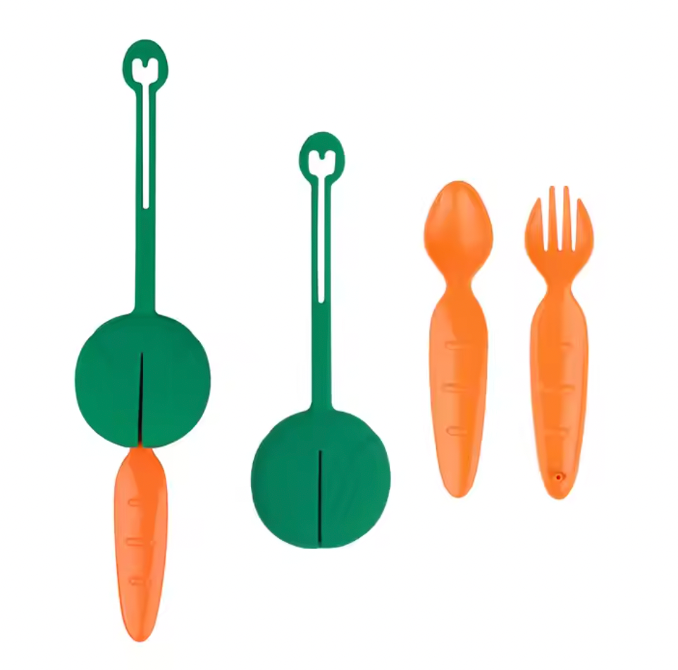 Green and orange lunchbox cutlery shown both in the case and out of the case.