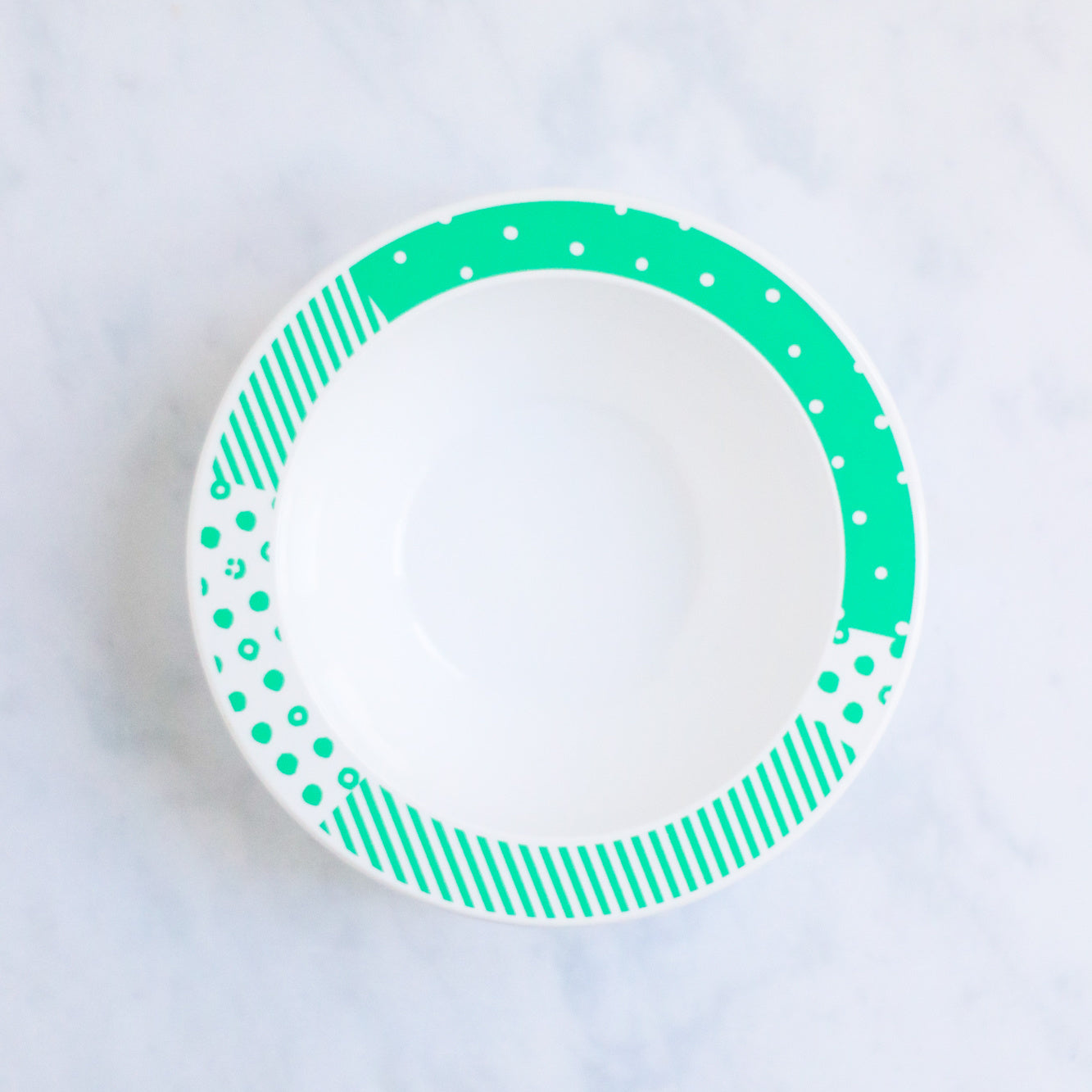 White and green patterned melamine bowl