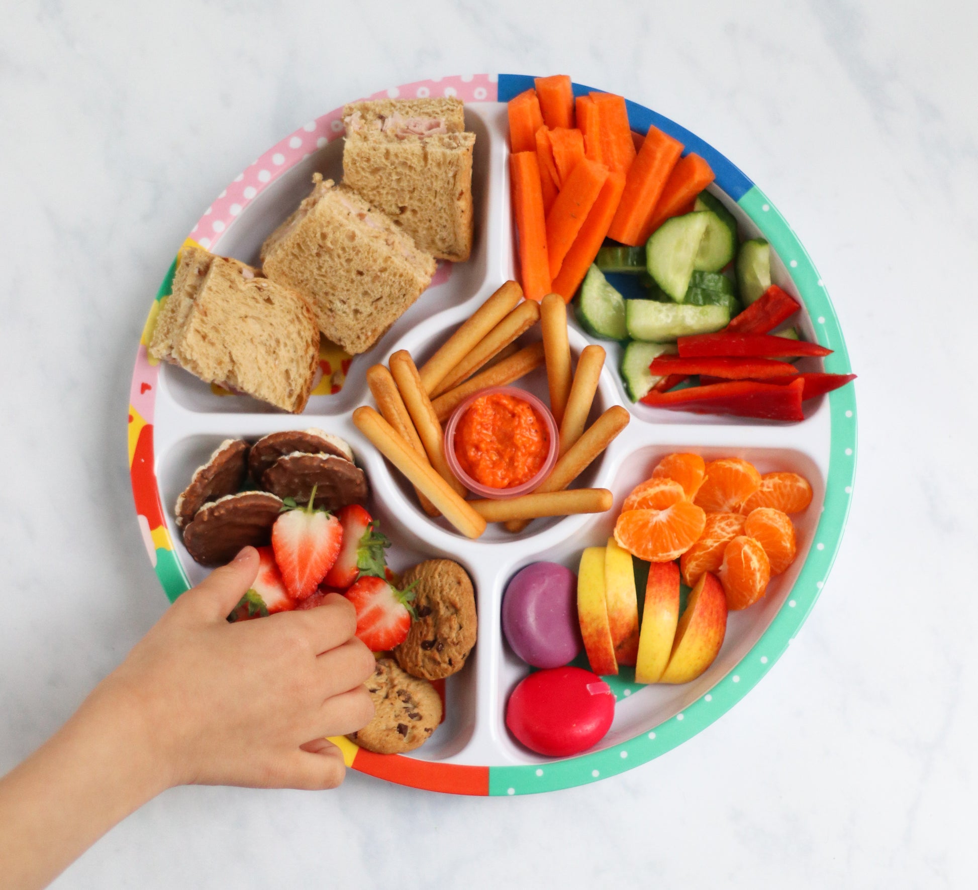 The Biggie Divided Plate For Kids filled with a variety of snacks